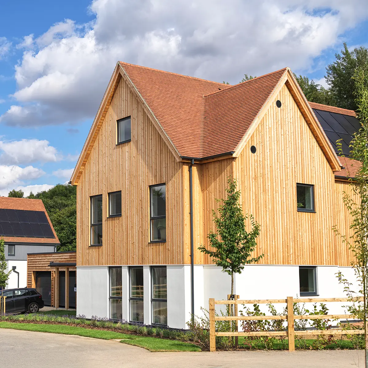 Contemporary wooden house in Oxfordshire with solar panels and garden.