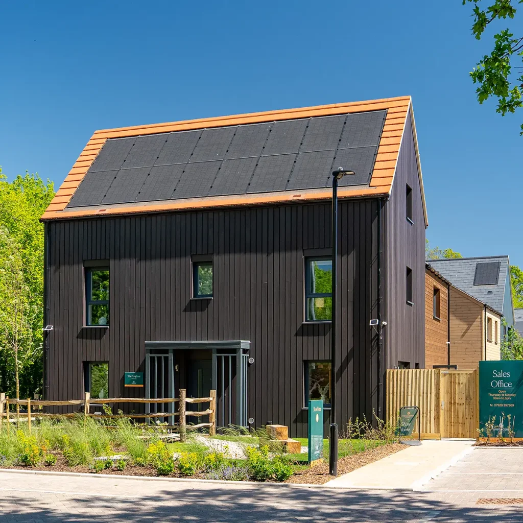 Contemporary black house with solar panels in Oxfordshire, UK.